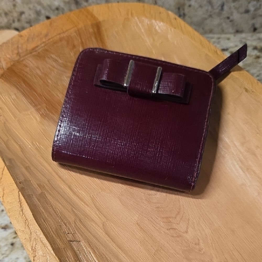 Coach Darcy bow wallet in a burgundy/maroon textured leather. - Picture 1 of 6